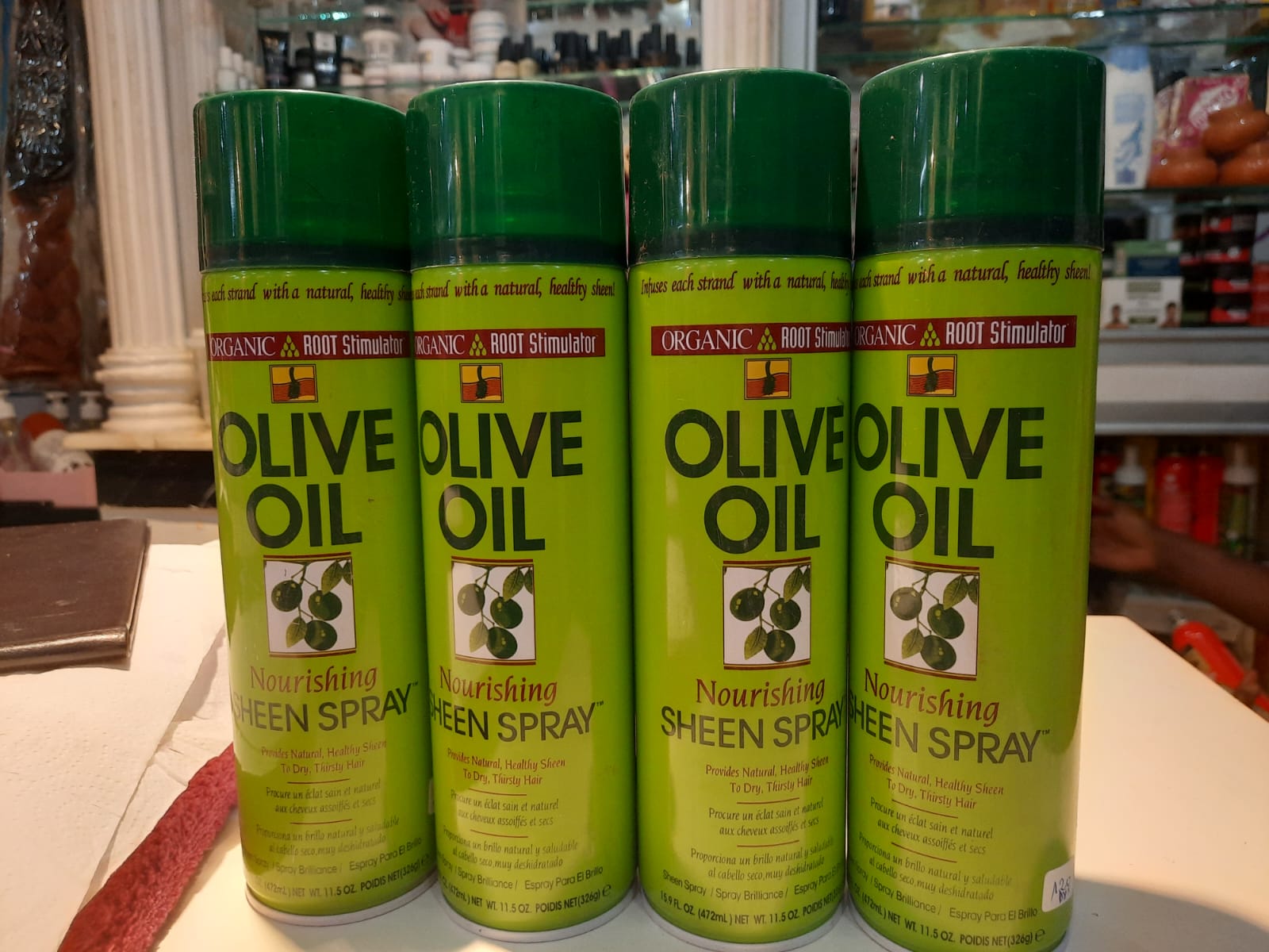 ORS Olive Oil Sheen Spray — soin capillaire